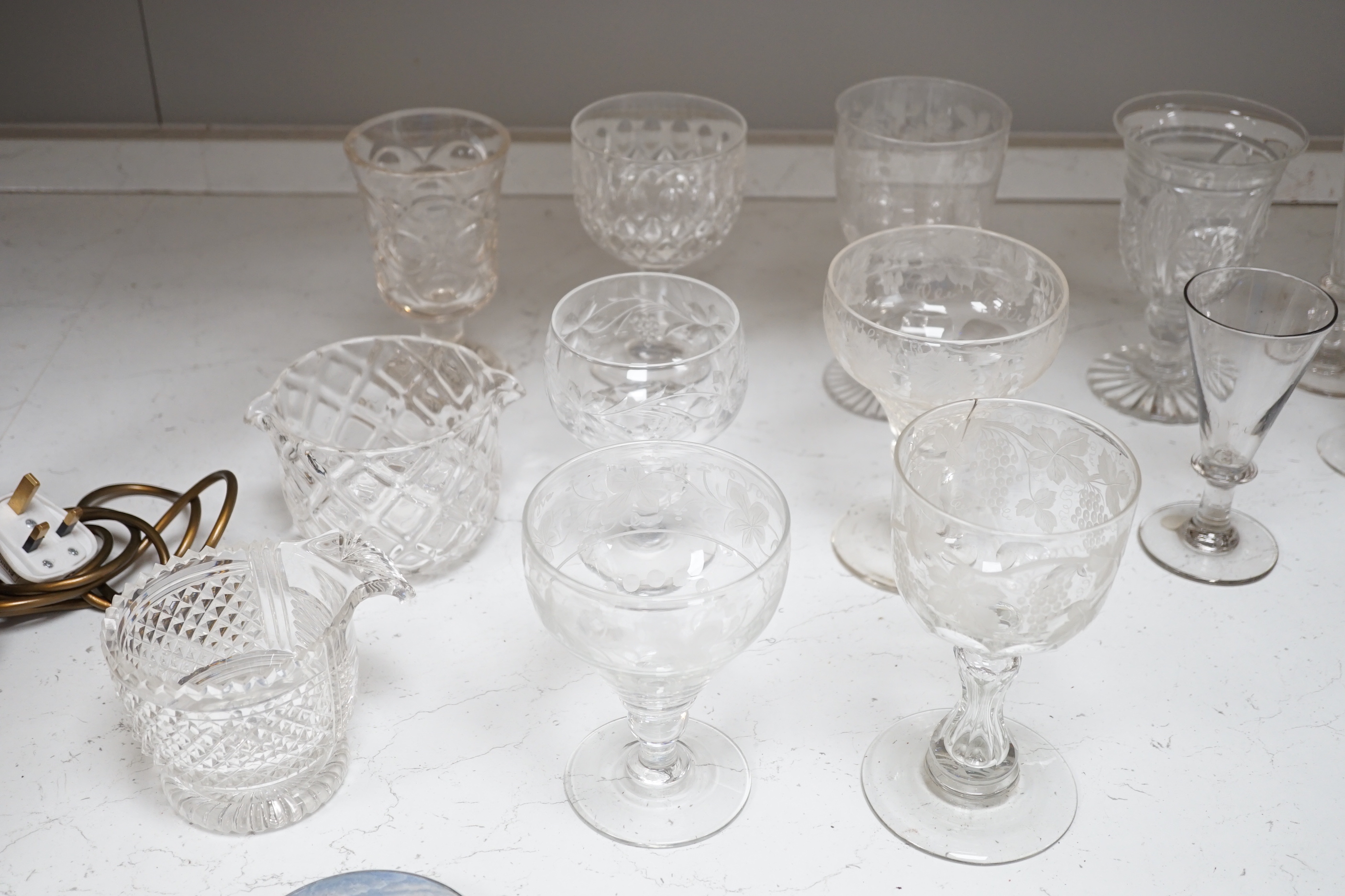 A group of Regency to Edwardian cut drinking glasses, decanters etc including rummers
